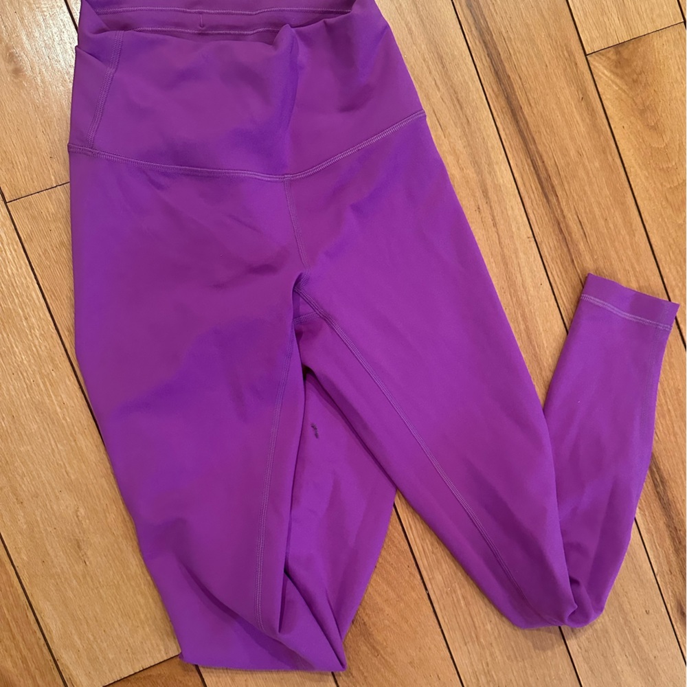 Bright purple lululemon base pace tights 28”